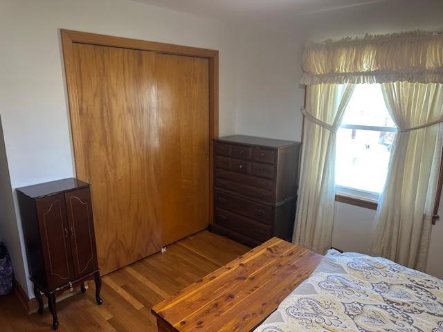 bedroom featuring wood finished floors