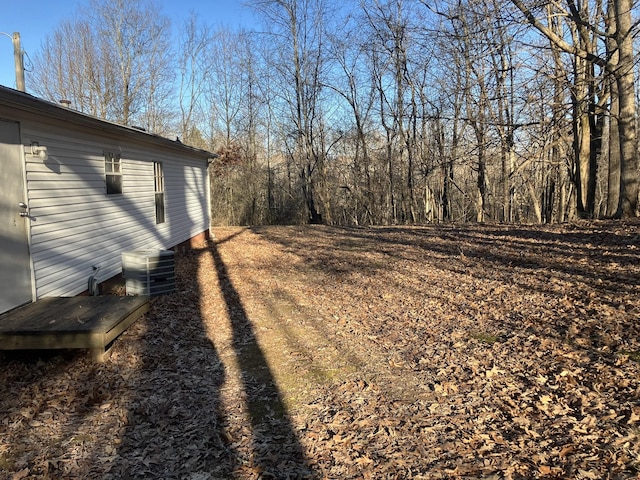 view of yard with central air condition unit