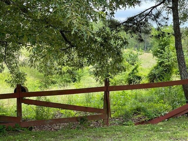 view of gate with fence