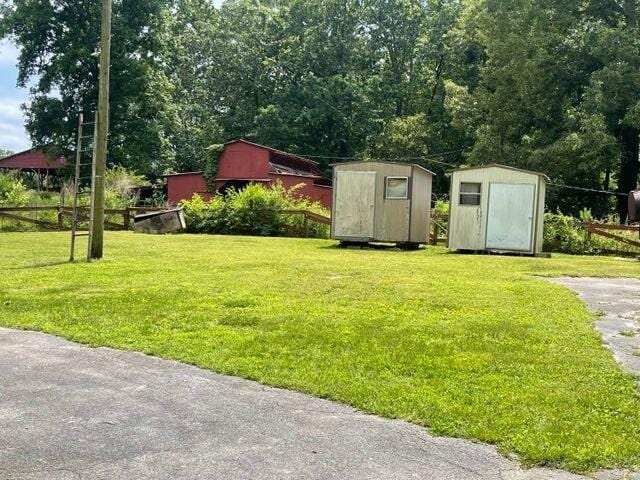 view of yard with an outbuilding and a shed