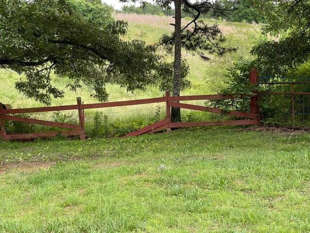 view of gate with fence