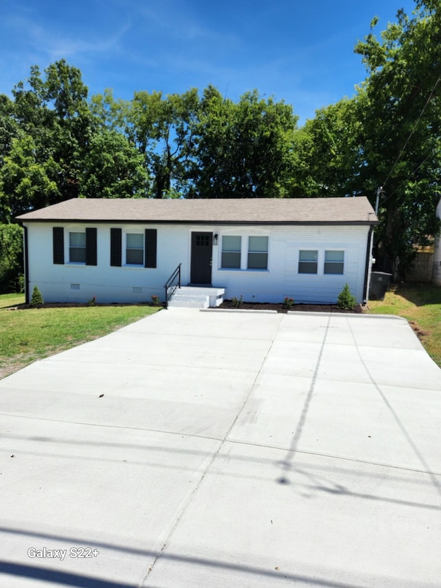 ranch-style home with a front yard and crawl space