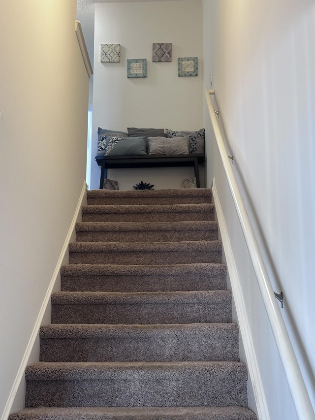 staircase with baseboards