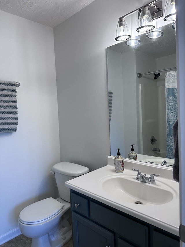 bathroom with a textured ceiling, vanity, toilet, and a shower with curtain