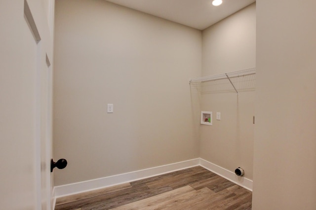 laundry room with recessed lighting, laundry area, washer hookup, wood finished floors, and baseboards