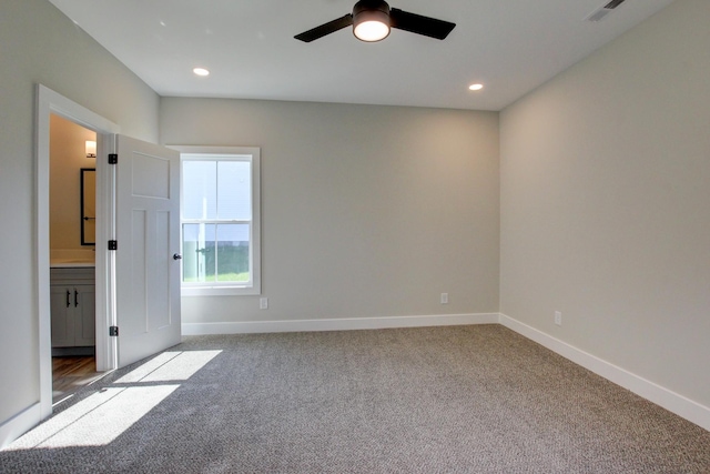 carpeted spare room with a ceiling fan, recessed lighting, visible vents, and baseboards