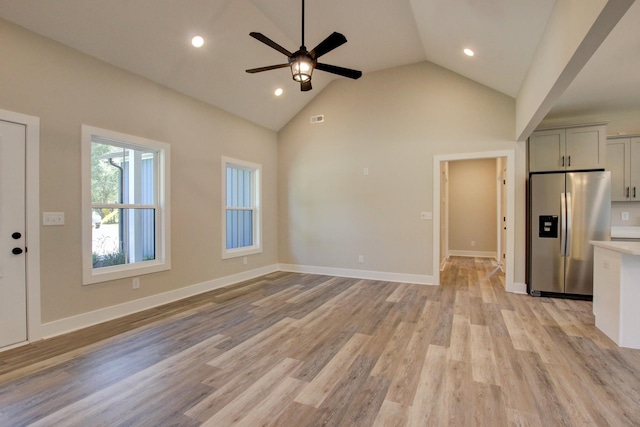 unfurnished living room featuring recessed lighting, ceiling fan, light wood-style flooring, and baseboards