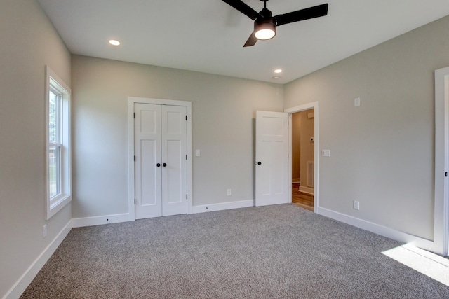 unfurnished bedroom with carpet floors, recessed lighting, and baseboards