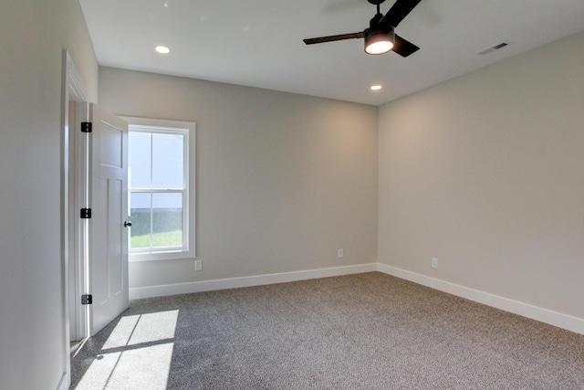 carpeted spare room featuring baseboards, visible vents, a ceiling fan, and recessed lighting