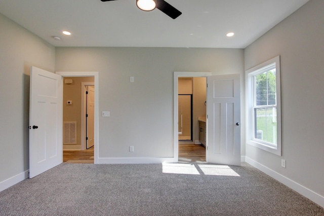 unfurnished bedroom with baseboards, visible vents, carpet flooring, and recessed lighting