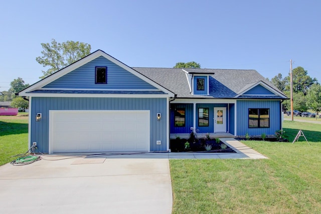 view of front facade with a shingled roof, concrete driveway, an attached garage, board and batten siding, and a front yard