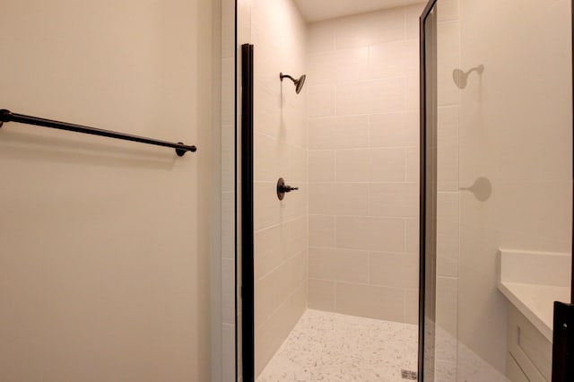 bathroom with a shower stall