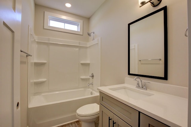 bathroom with shower / washtub combination, vanity, and toilet