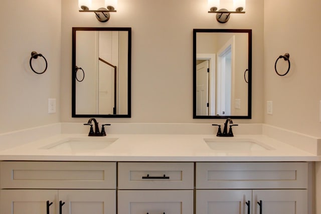 bathroom with double vanity and a sink