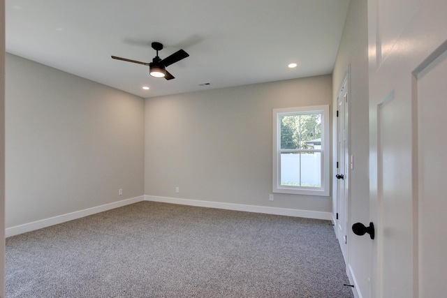 spare room featuring recessed lighting, carpet floors, visible vents, a ceiling fan, and baseboards