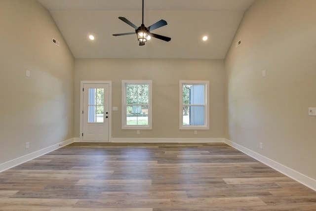 interior space featuring recessed lighting, wood finished floors, visible vents, and baseboards