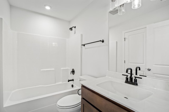 bathroom featuring toilet, vanity, and shower / bathing tub combination