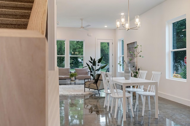 dining area featuring recessed lighting, baseboards, and ceiling fan with notable chandelier