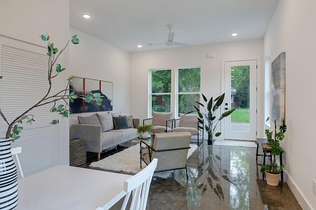 living area with recessed lighting, marble finish floor, ceiling fan, and baseboards