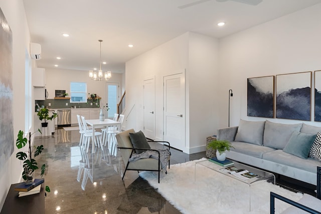 living room with marble finish floor, recessed lighting, a wall mounted AC, baseboards, and ceiling fan with notable chandelier