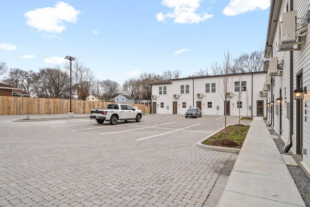 uncovered parking lot with fence