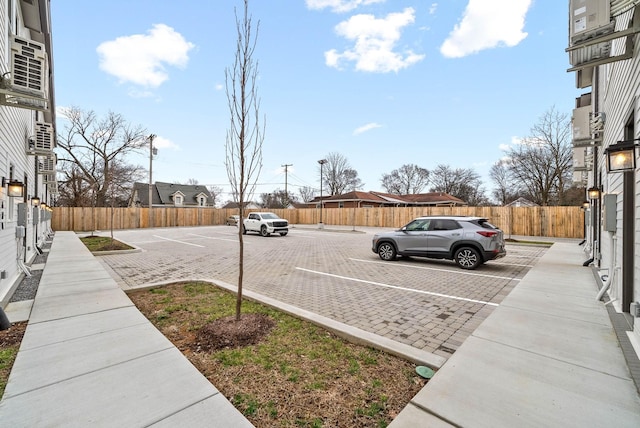 uncovered parking lot with fence