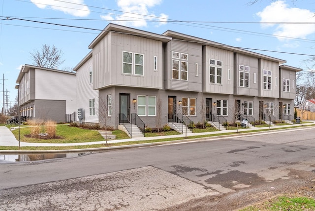 view of property with a residential view and board and batten siding