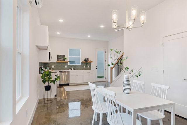 dining area featuring baseboards and recessed lighting