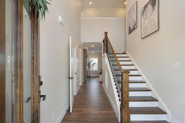 entrance foyer featuring stairs, baseboards, wood finished floors, and recessed lighting