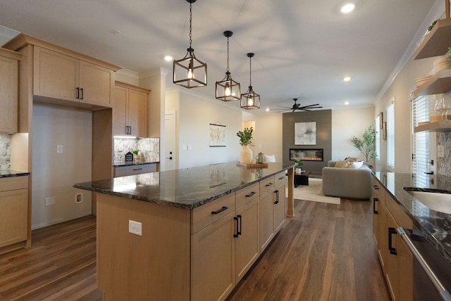 kitchen featuring dishwasher, a fireplace, dark wood-style floors, and crown molding