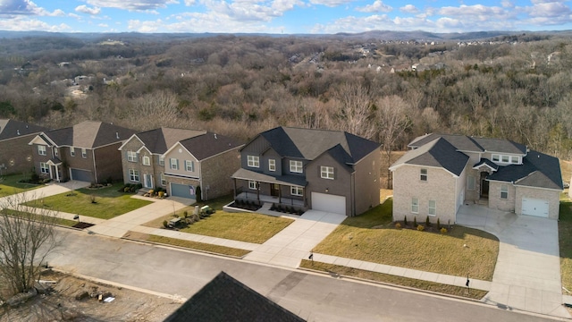 aerial view with a residential view and a wooded view