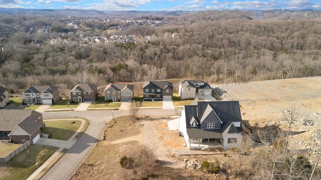 aerial view with a residential view and a view of trees