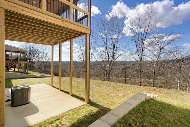 view of yard featuring a patio and central AC unit