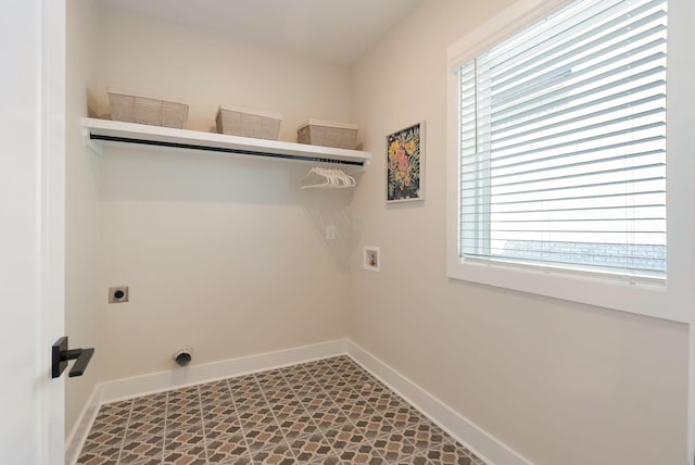 laundry room with washer hookup, laundry area, electric dryer hookup, and baseboards