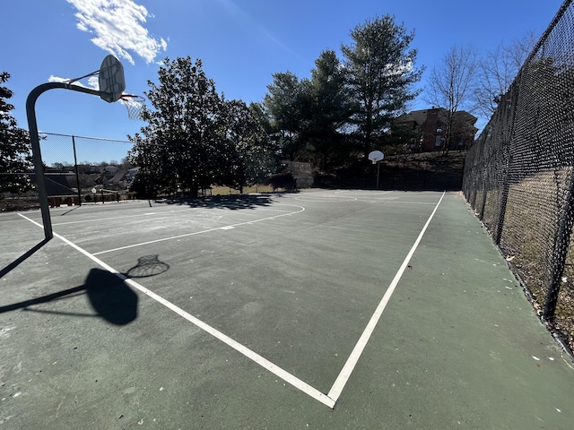 view of sport court with community basketball court and fence