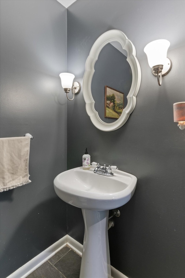 bathroom featuring baseboards and tile patterned floors