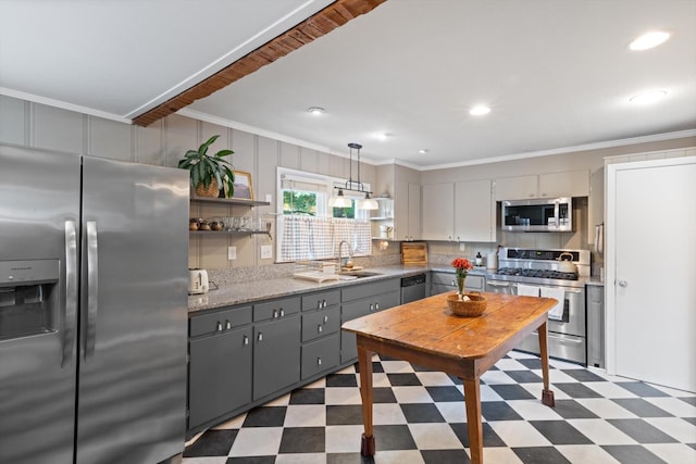 kitchen with ornamental molding, appliances with stainless steel finishes, gray cabinets, and tile patterned floors