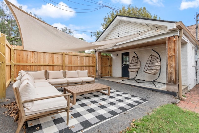 view of patio / terrace featuring fence and an outdoor hangout area