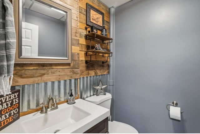 bathroom with toilet and vanity