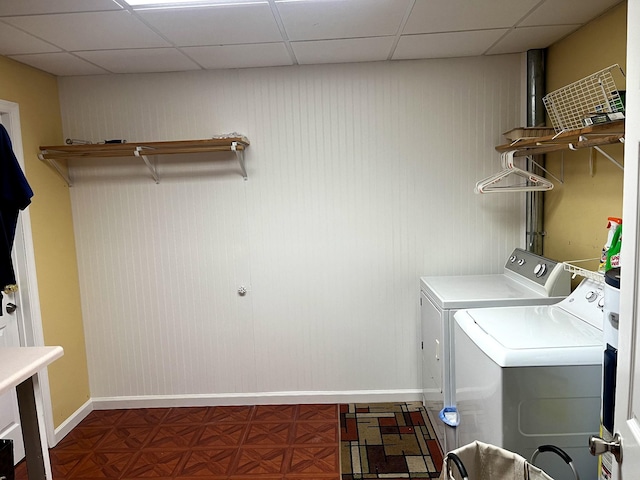 laundry area featuring laundry area, baseboards, and separate washer and dryer