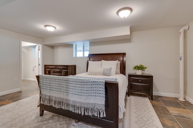 bedroom featuring baseboards