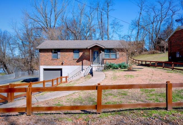 view of front of property with a fenced front yard, a garage, brick siding, a shingled roof, and a front lawn