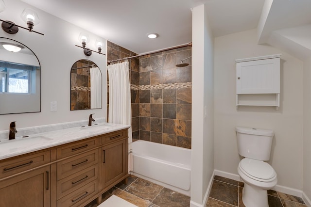 full bath with baseboards, a sink, toilet, and shower / bathtub combination with curtain