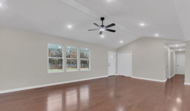 unfurnished living room with lofted ceiling, ceiling fan, baseboards, and wood finished floors