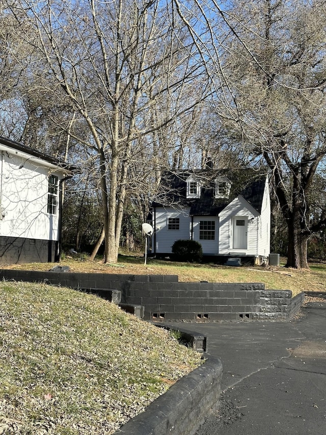 exterior space with entry steps and central AC