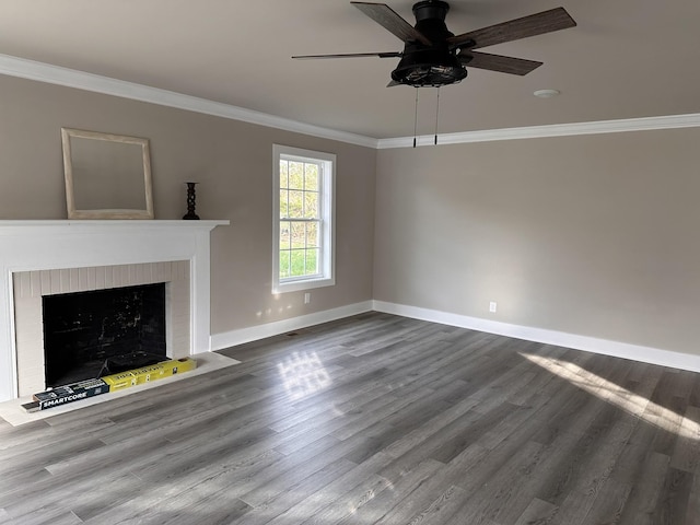 unfurnished living room featuring baseboards, crown molding, a ceiling fan, and wood finished floors