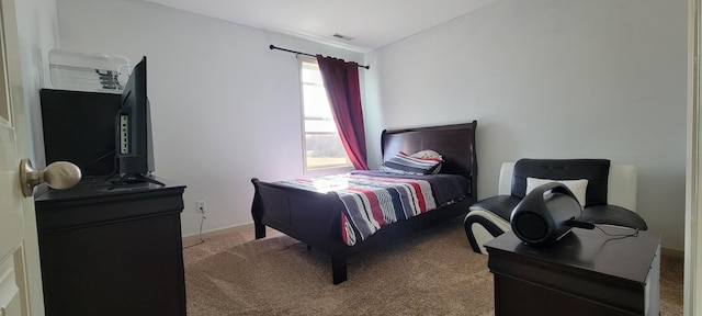 carpeted bedroom with baseboards and visible vents