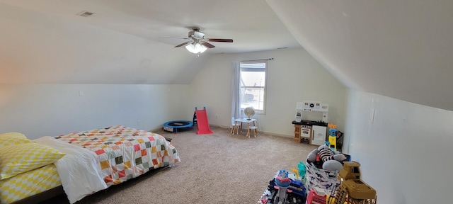 bedroom with ceiling fan, carpet flooring, visible vents, baseboards, and vaulted ceiling