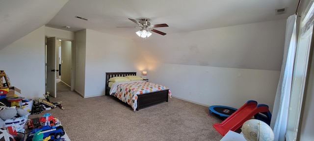 bedroom featuring visible vents, a ceiling fan, carpet flooring, vaulted ceiling, and baseboards