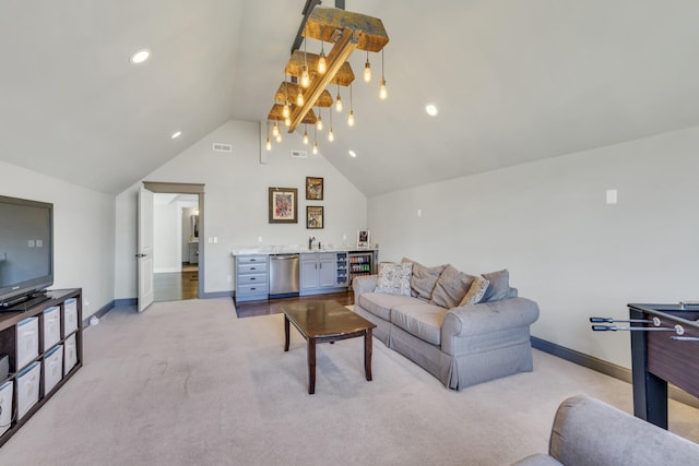 living room with light carpet, indoor wet bar, and baseboards